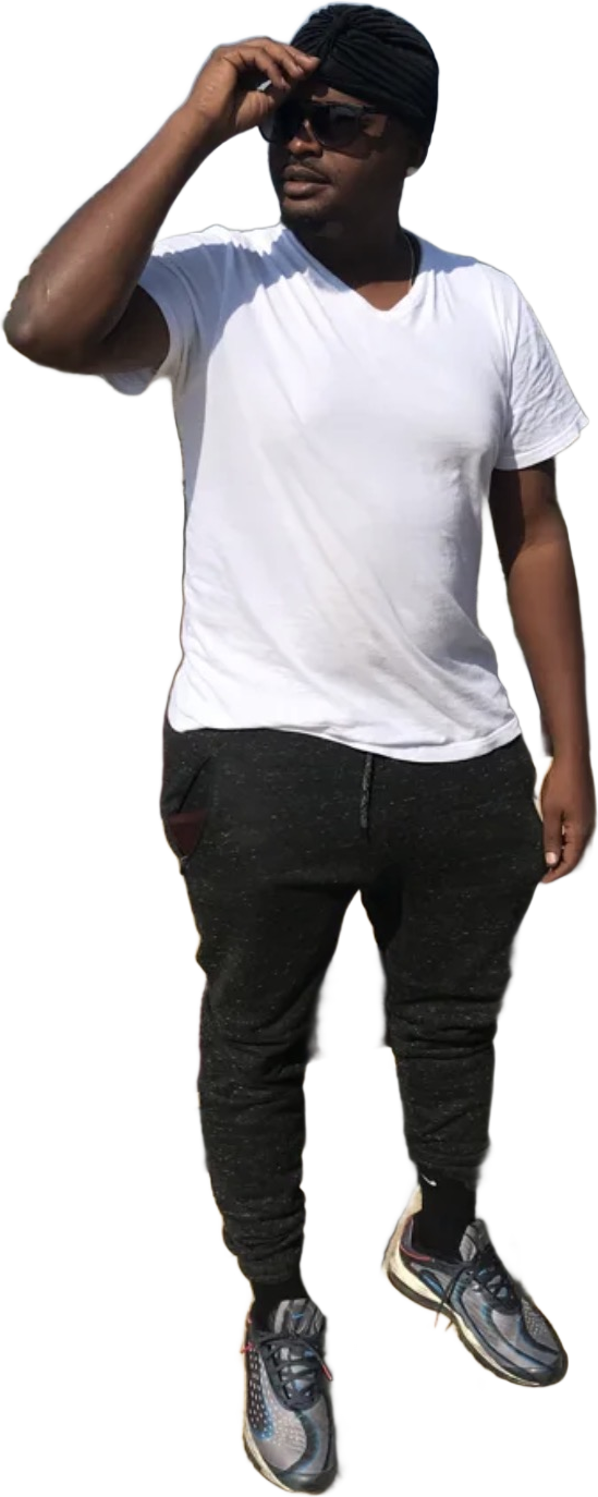 Christopher Charles standing full length in a white T-shirt, black turban, sunglasses and sneakers